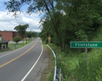 2016-06-25_13_03_53_View_west_along_Maryland_State_Route_144__National_Pike__entering_Flintstone__Allegany_County__Maryland.jpg