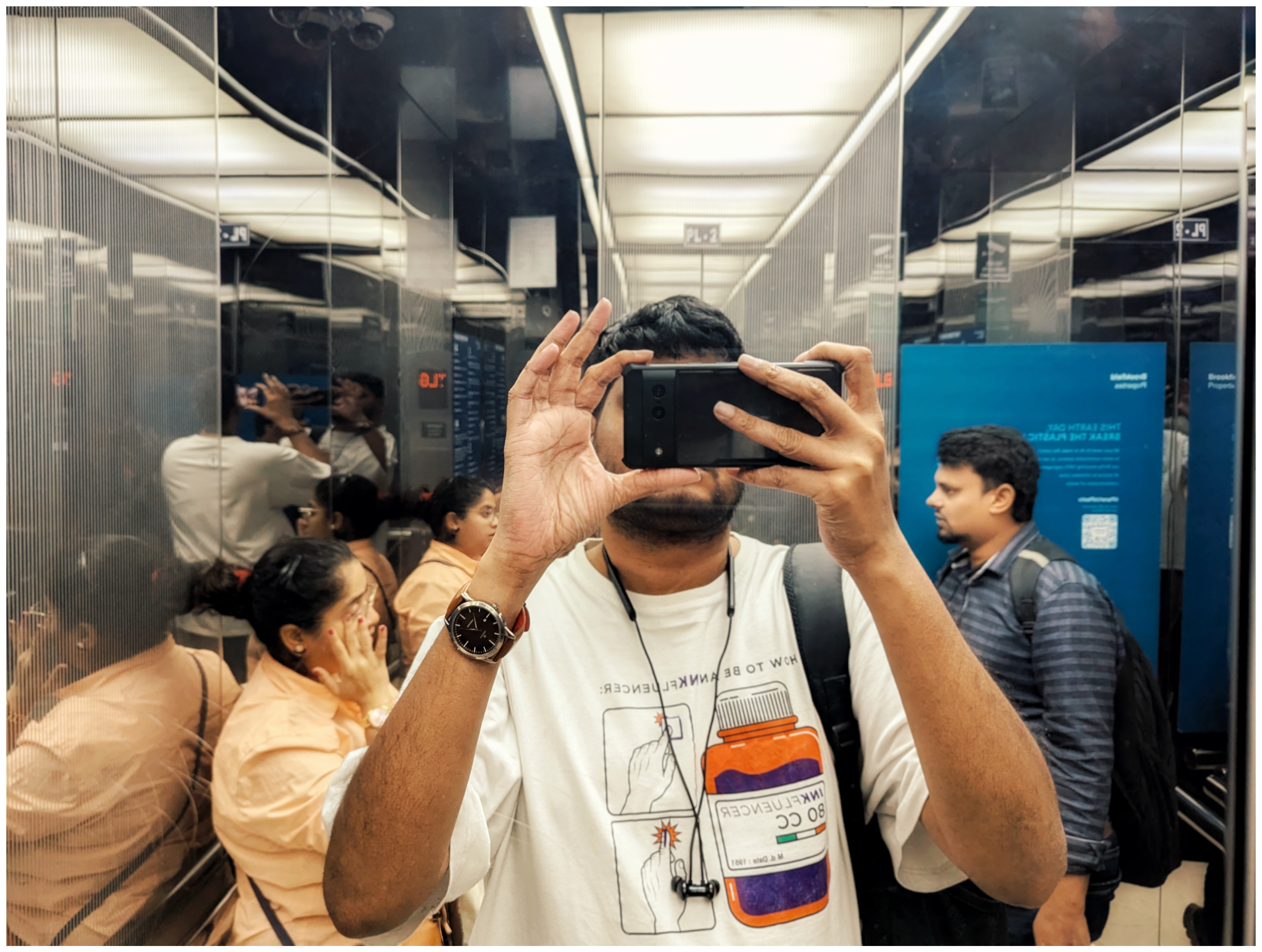 self portrait in a mall elevator