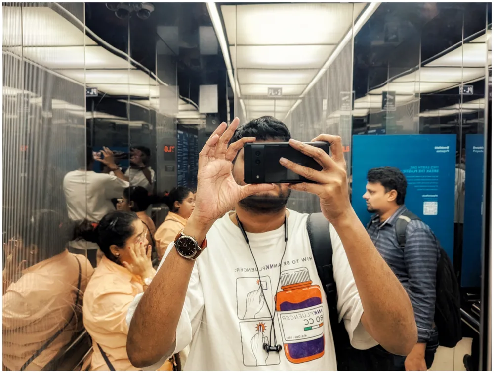 self portrait in a mall elevator