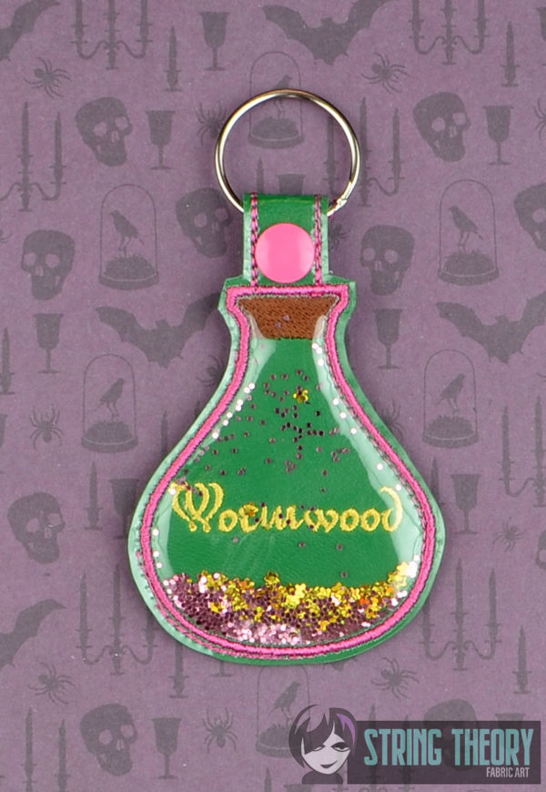 Wormwood Poison Bottle Trapped Snap Tab Key Fob