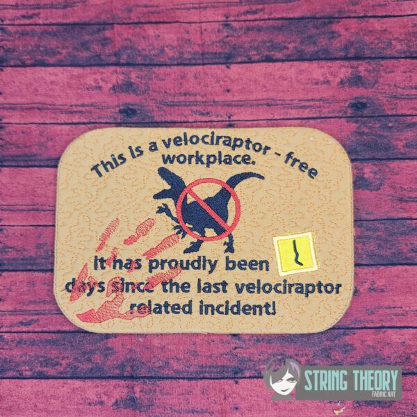 This is a Velociraptor Free Workplace Mug Rug - Image 4