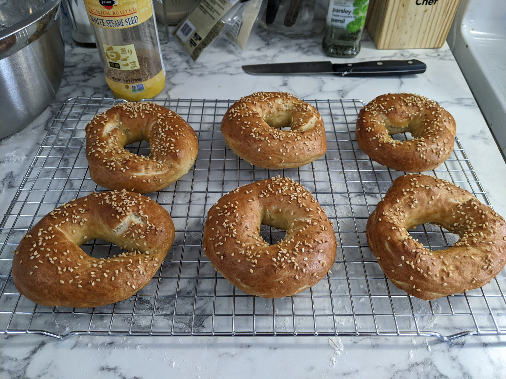 Baked homemade bagels on a cooling rack