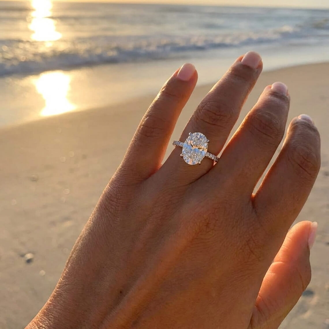 Side stone engagement ring