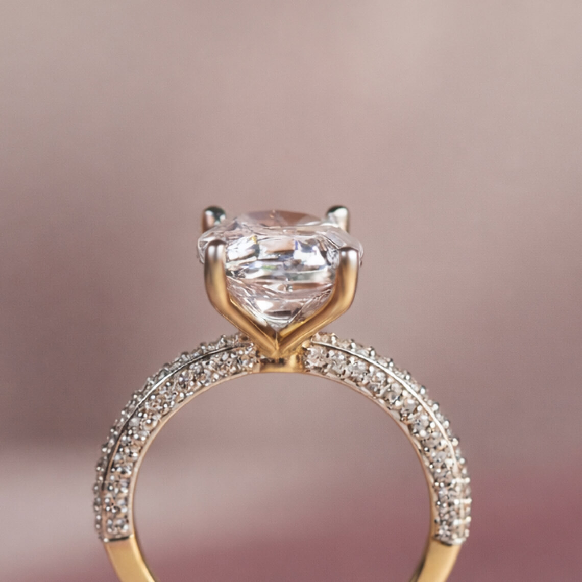 Side stone oval engagement rings