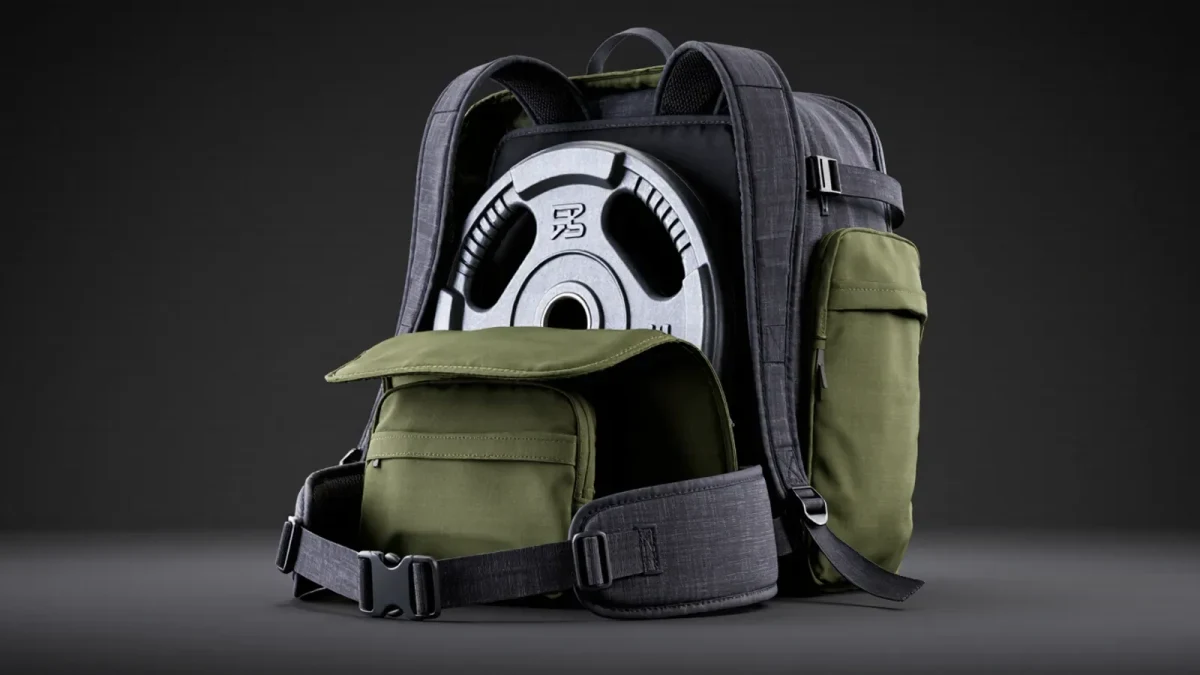 Close-up of loaded rucksack with weight plates on shoulders
