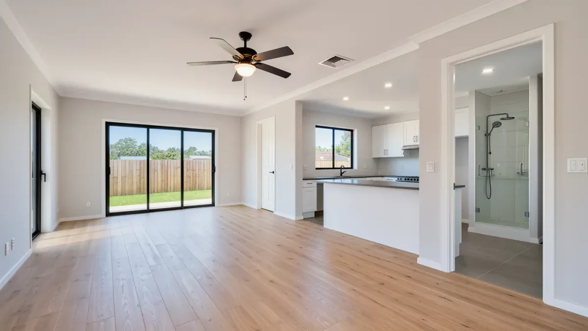Bright single-level open-plan home interior with wide doorless openings