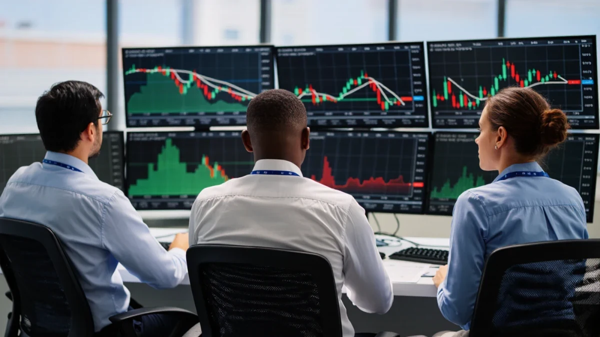 Options traders monitoring volatility readings on a busy exchange floor