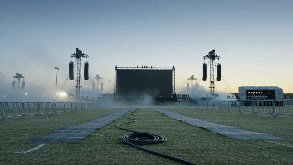 Empty festival main stage field at dawn before gates open