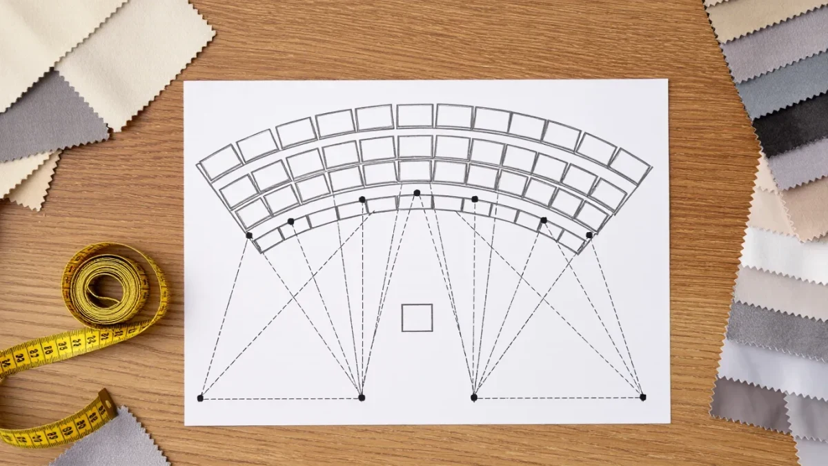 Overhead view of a hand-drawn fashion show seating chart with place cards and sightlines