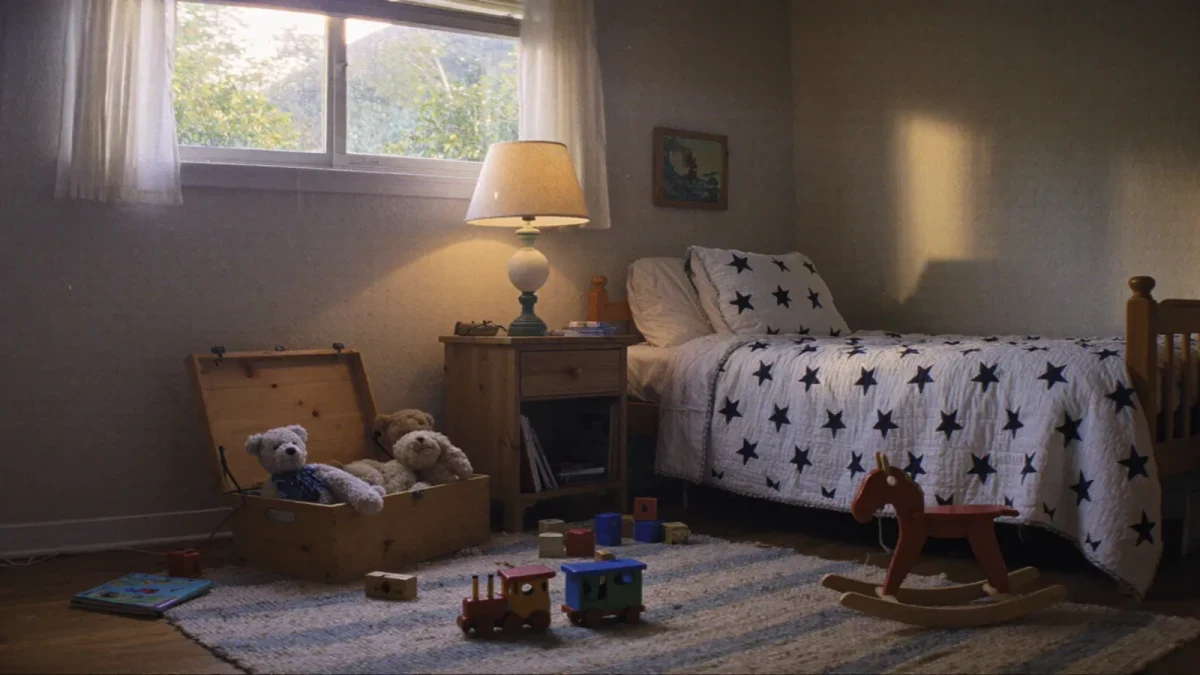 Toy-filled child's bedroom at dusk with warm lamp glow