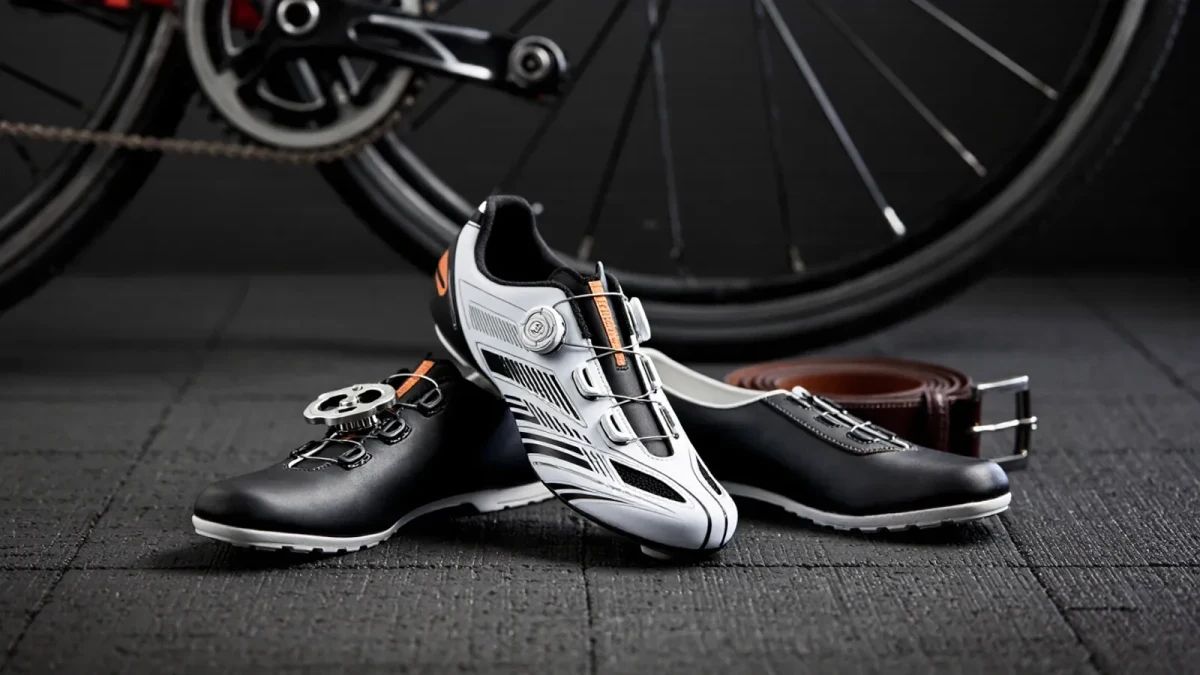 Studio close-up of cycling shoes clipped beside lifting shoes