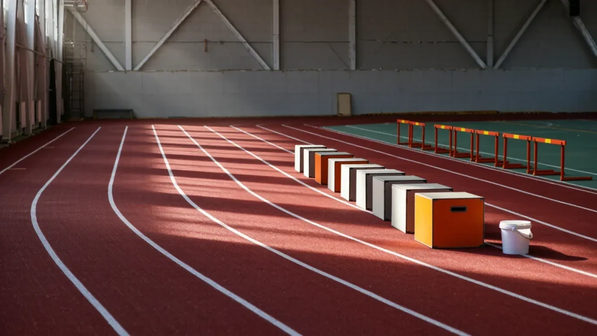 Rubber jump boxes and track hurdles on an empty indoor track