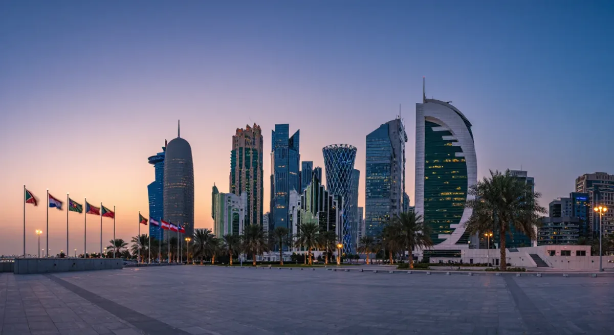 Doha skyline at dusk with flags at half-mast