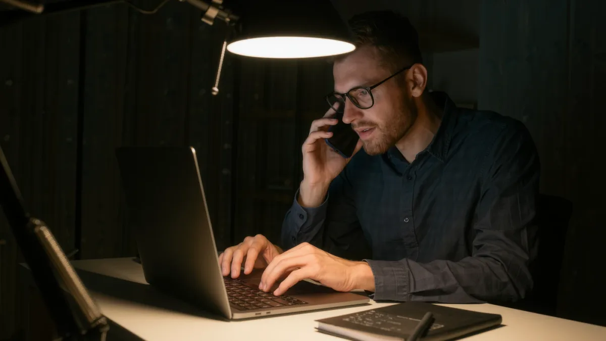 Man urgently working to secure accounts on a clean laptop