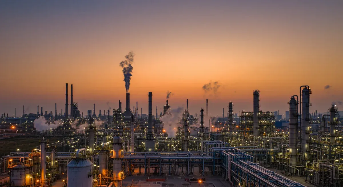 Refinery towers and pipework at dusk