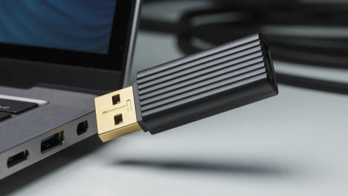 Close-up of a hardware security key plugged into a laptop