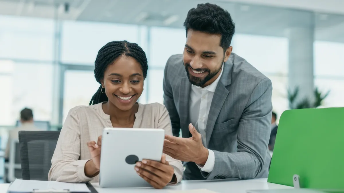 Customer confirming an electronic consent step with a bank agent observing