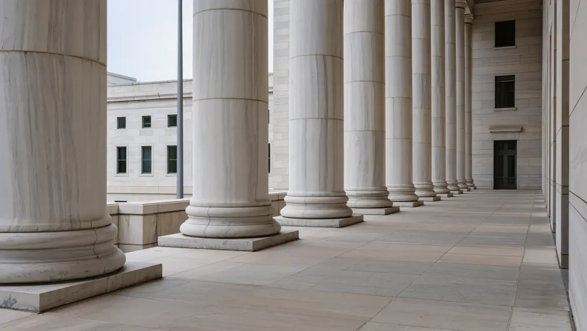 Marble colonnade of a federal office building in flat overcast light