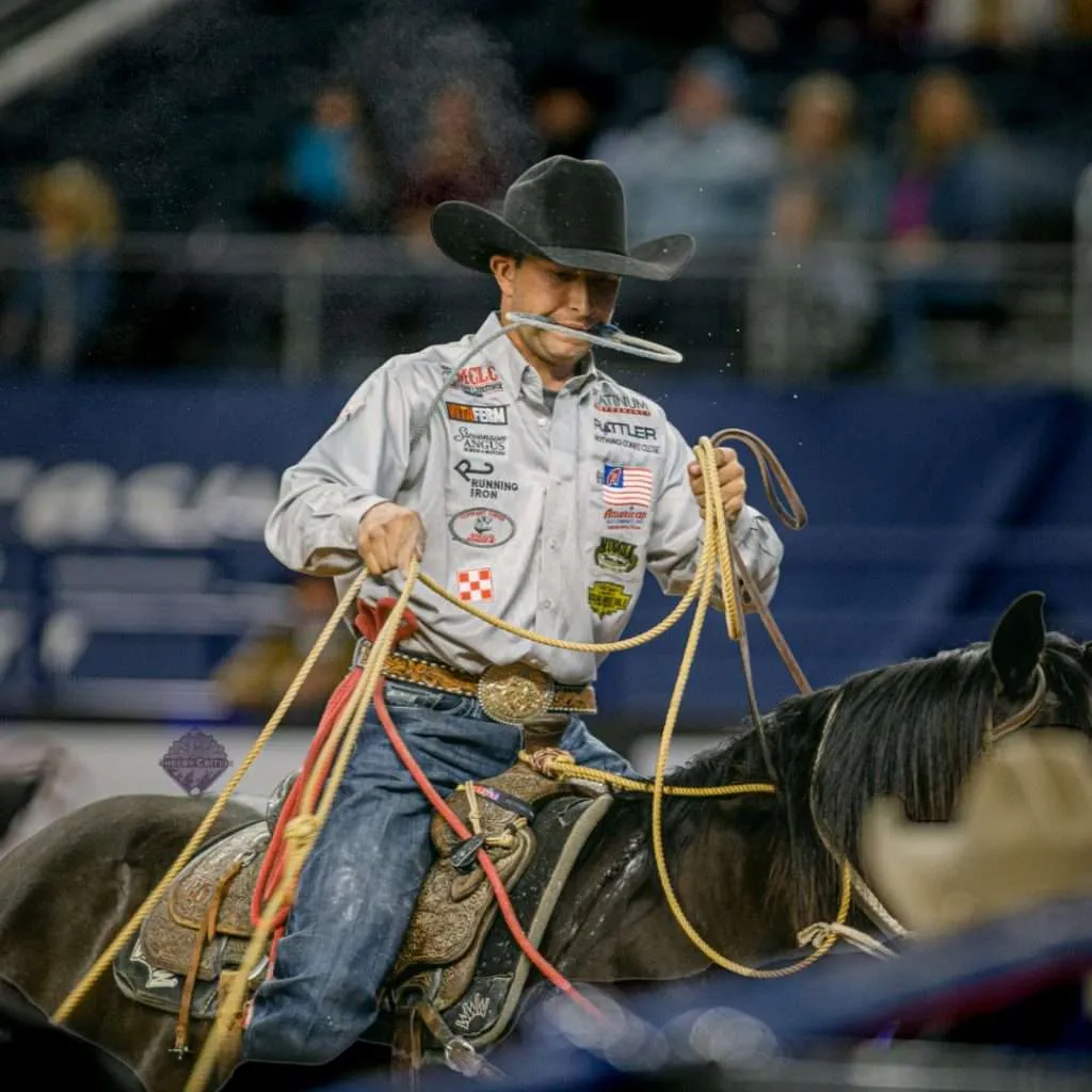 Haven Meged riding a horse during a roping competition