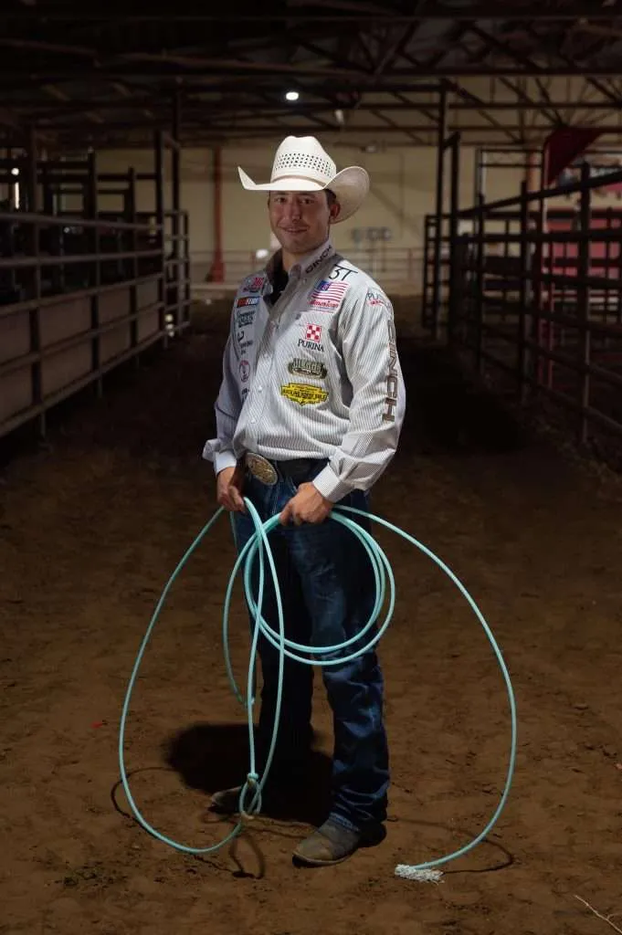 273776543_398113688787161_8968945268637868709_n - Western Ranch Brokers Haven Meged in cowboy hat holding rope