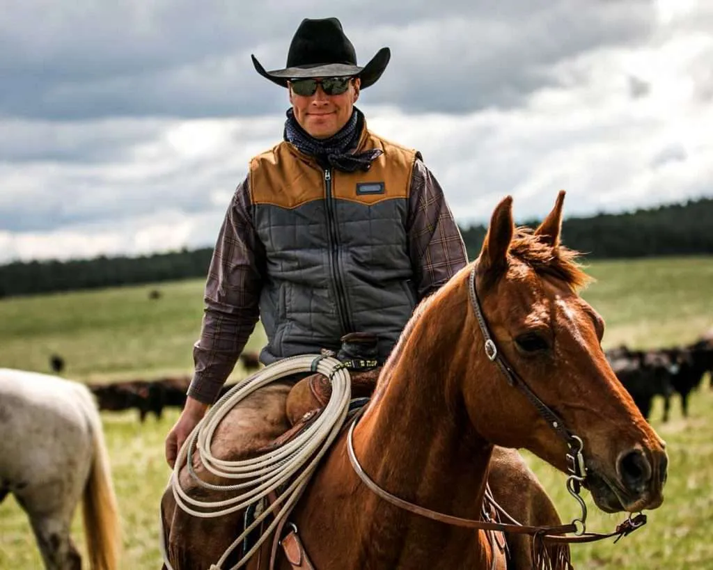 Ranch broker Caleb Campbell on horseback