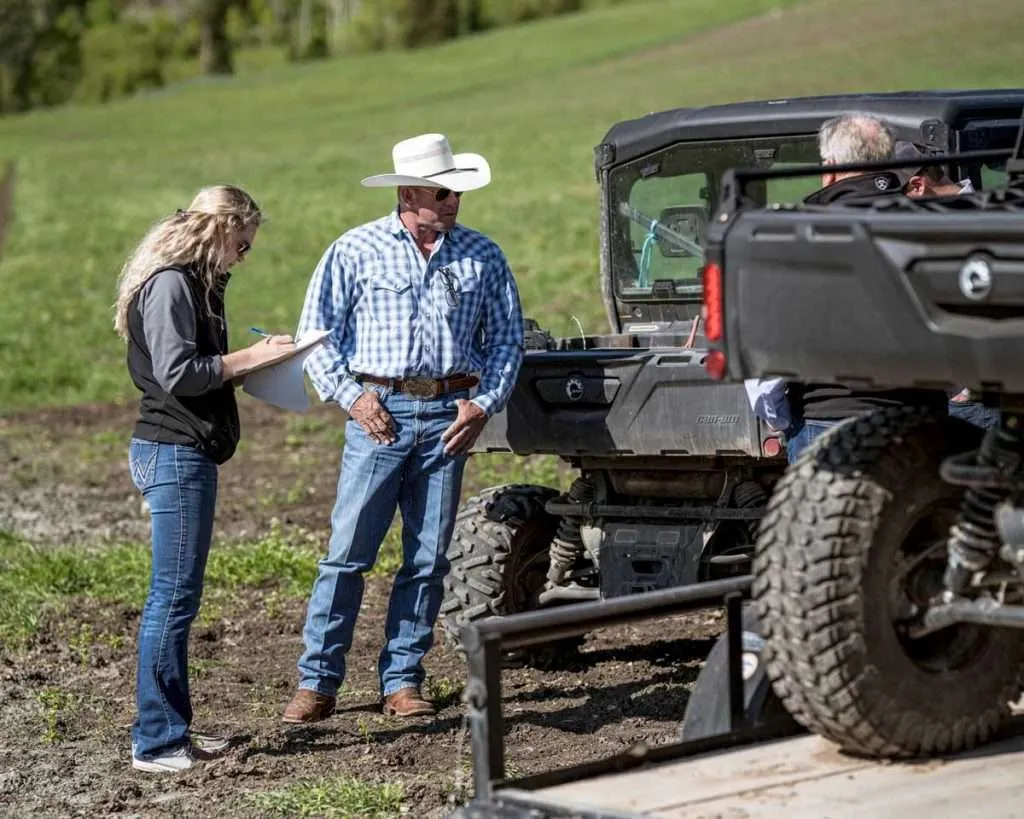 Ranch broker Bill Boyce on a Montana ranch with Morgan Zupan