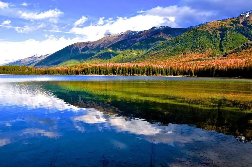 Seeley Lake - Western Ranch Brokers Blue sky and mountains reflected in Seeley Lake