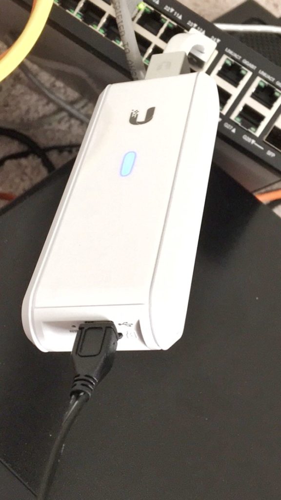 UniFi Cloud Key powered by a USB cable and plugged into a non-PoE network switch