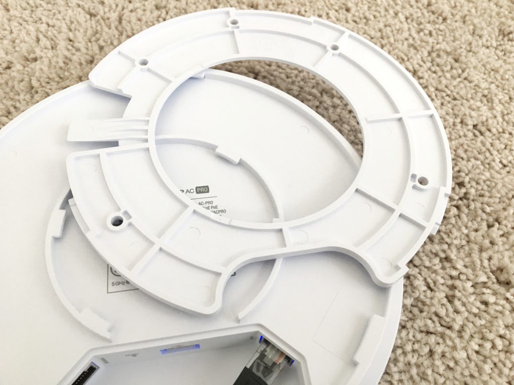 UniFi AP AC Pro with its back mounting ring detached