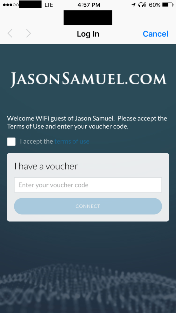 Guest hotspot captive portal on an iPhone asking the guest to accept the terms of use and enter a voucher code