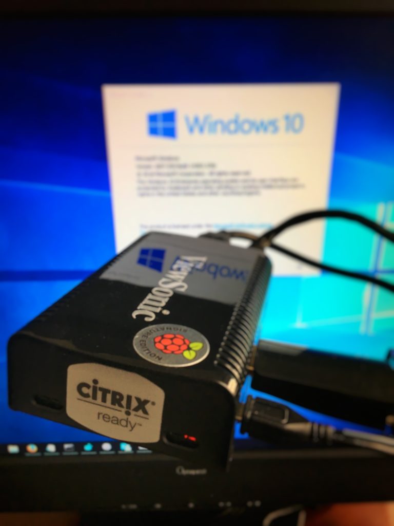 ViewSonic Citrix Ready Raspberry Pi thin client in front of a monitor showing a Windows 10 virtual desktop