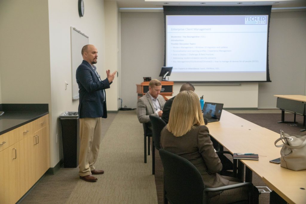 IGEL's Trey Baumgardner leading the Enterprise Client Management breakout in front of the session's topic slide