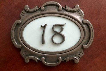The plate with the number on the door