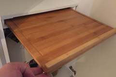 Under shelf cutting board holder