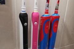 Electric toothbrush holder for attaching to the wall