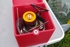 A case for transporting a camping gas burner.