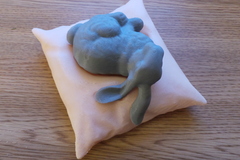 Stanford bunny resting on a pillow